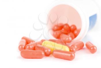 Red and yellow pills isolated on a white background