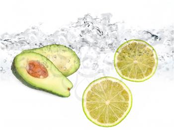 Royalty Free Photo of Limes and Avocado in Water