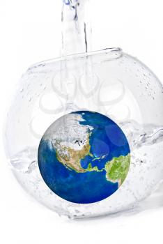 Royalty Free Photo of a Globe in a Bowl of Water