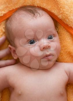 Royalty Free Photo of a Baby Lying on a Blanket 