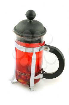French press with hot berries tea on white