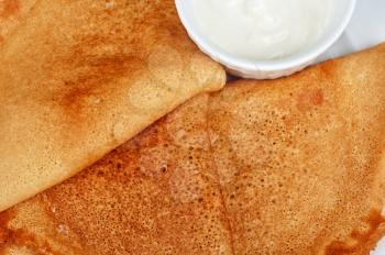 pancakes with sour cream closeup