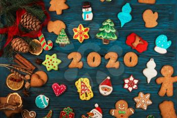Gingerbreads for new 2020 year holiday on wooden background, xmas theme