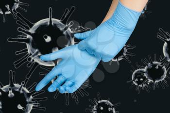 Hand in protective gloves on corona virus COVID-2019 background.