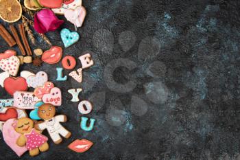 Gingerbreads for love or marrige on dark concrete background