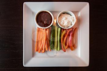 Fresh carrot cucumber pepper and two sauce. Healthy food. Low-Carb Diet. Vegetarian food.