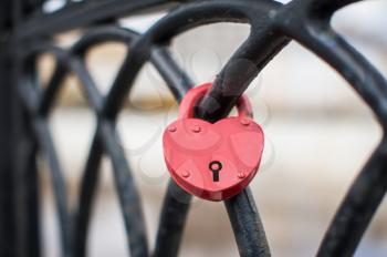 Heart shaped love padlock at the bridge symbolizing a strong marriage