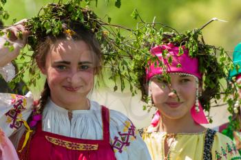 TOPOLNOE, ALTAY, RUSSIA - May 27, 2018: Folk festivities dedicated to the feast of the Holy Trinity. Happy young girls in traditional dress