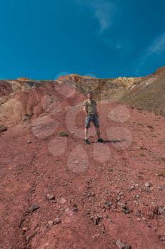 Man in Valley of Mars landscapes in the Altai Mountains,