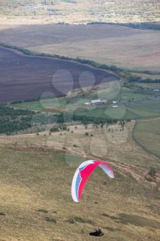 Paragliding in the mountains. Paragliders in fight in the mountains, extreme sport activity.