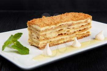 Esterhazy traditional cake on a white plate with mint