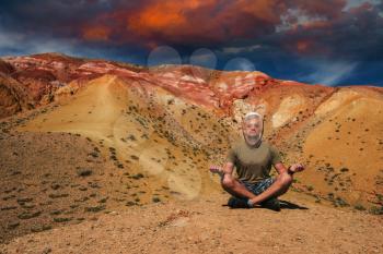 Man in mask on mars landscape with beauty sky sunset