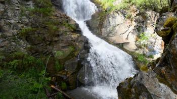 Waterfall in the Altai mountains. Beautiful nature summer landscape.