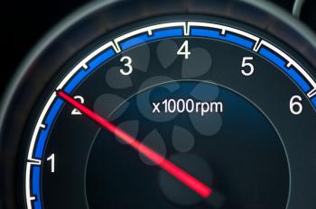 Close up on a tachometer of auto