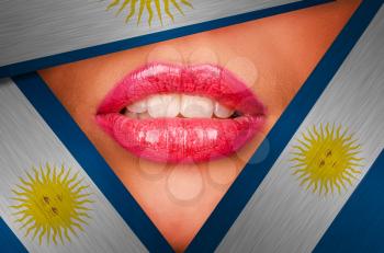 Beautiful female lips closeup behind argentina background