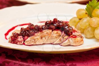 chicken breast meat with cranberry sauce