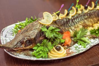 sturgeon baked with greens fruits and vegetables