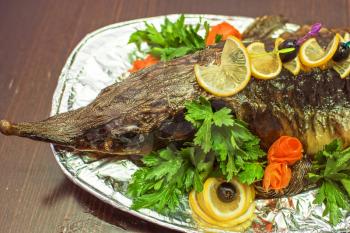 sturgeon baked with greens fruits and vegetables
