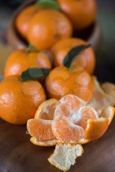 Ripe tangerines on wooden background