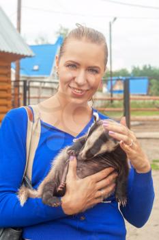 Young attractive woman with badger