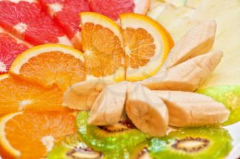 Slices of various fruits closeup photo