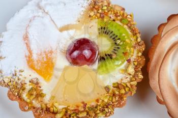 sweet cakes with fruits closeup photo