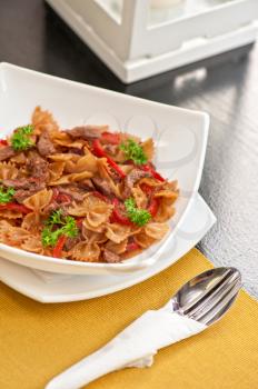 Farfalle with vegetable and beef meat