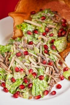 salad with meat  sauce and pomegranate