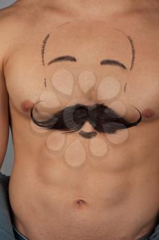 male torso with moustache and beard at chest