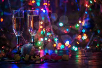 two shampagne glasses on celebratory table