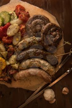 Grilled sausage with vegetables surved with sauce