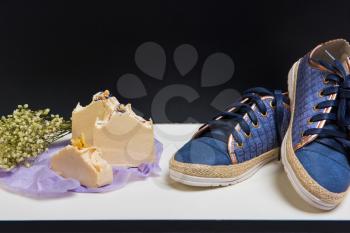 Set of shoes, soap and aroma bouquet of dried flowers