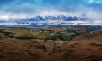 Aerial drone panoramic picture of Kurai steppe and Chuya river on North-Chui ridge background. Altai mountains, Russia.
