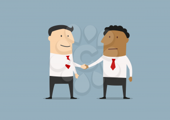 Two businessmen of different ethnicity standing shaking hands at the conclusion of a business deal