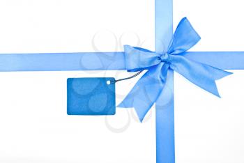 Royalty Free Photo of a Blue Ribbon and Bow With a Label