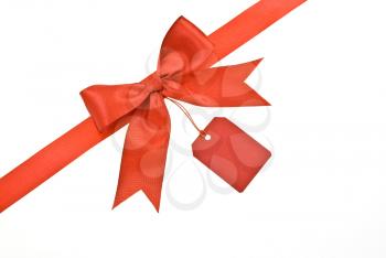 Royalty Free Photo of a Red Bow With Label