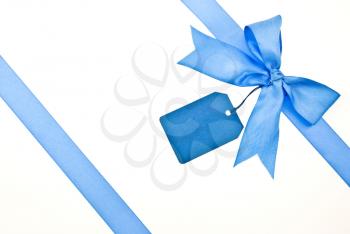 Royalty Free Photo of a Blue Bow With Label