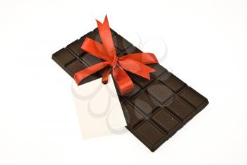 Black chocolate with red ribbon and card 