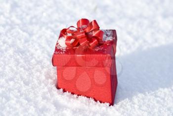 Royalty Free Photo of a Red Gift Box on Snow