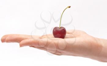 Royalty Free Photo of a Hand Holding a Cherry