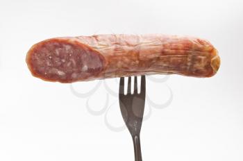 Royalty Free Photo of a Sausage on a Fork