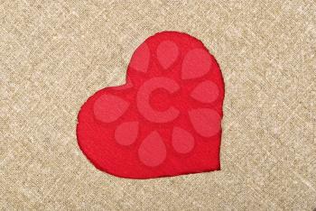 Royalty Free Photo of a Red Heart on a Burlap Sack