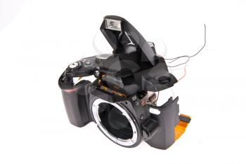 Broken and disassembled DSLR photocamera 