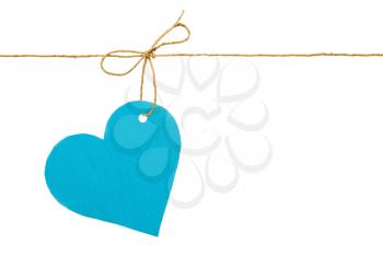 Blue paper heart on a rope with a bow