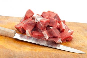 Royalty Free Photo of a Mound of Chopped Meat on a chopping Block With a Knife