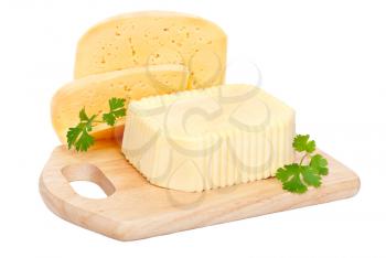 Royalty Free Photo of Butter, Cheese, and Garnish on a Wooden Cutting Board