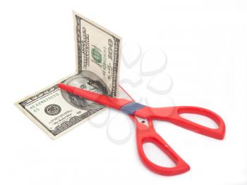 Royalty Free Photo of a Pair of Scissors Cutting a 100 Dollar Bill