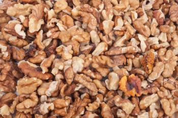 Heap of unshelled walnuts