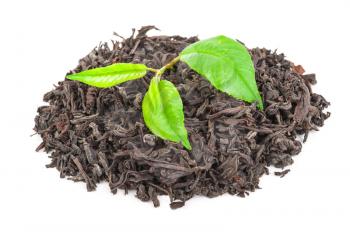 Heap of dry black tea with green tea leaves