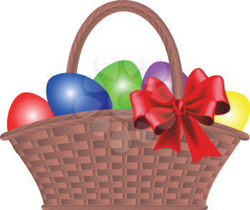 Wicker basket with dyed eggs and bow for Easter